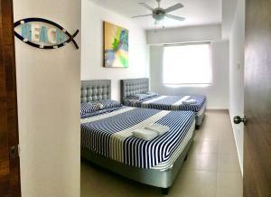 Postel nebo postele na pokoji v ubytování RESORT PLAYA AZUL 2 dormitorios