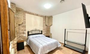A bed or beds in a room at COMPLEJO RURAL TORRES Y NAVAS