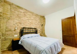 A bed or beds in a room at COMPLEJO RURAL TORRES Y NAVAS