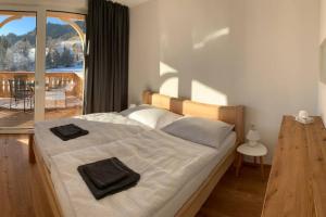 Posteľ alebo postele v izbe v ubytovaní Apartman Hechlstein v Tauplitz