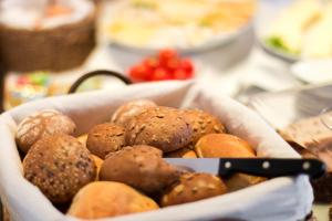 a bowl filled with different types of food on a table at Hotel Pension Treppengasse Nr. 5 in Altenburg