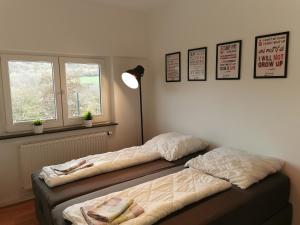 Postel nebo postele na pokoji v ubytování Ferienhaus Fräulein Frenz