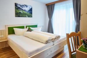 Postel nebo postele na pokoji v ubytování Gasthof Walderhof