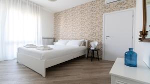 A bed or beds in a room at Italianway - Baracca 7 B