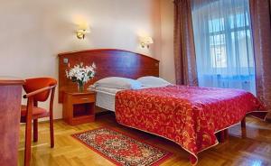 Posteľ alebo postele v izbe v ubytovaní Hotel Restauracja Caspar