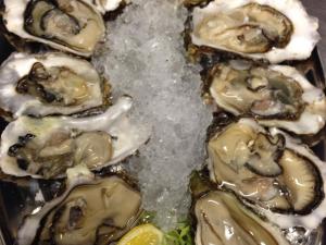 a group of oysters on ice with a lemon at Altes Backhaus in Arnsberg
