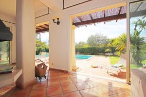 a living room with a sliding glass door to a pool at Villa Bogota by Algarve Vacation in Albufeira +42 photos