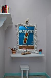 a mirror on a shelf in a room at Villa Ostria in Koufonisia