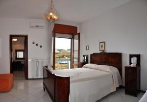 Postel nebo postele na pokoji v ubytování B&B Casa di Donna