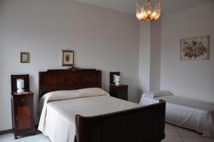 Postel nebo postele na pokoji v ubytování B&B Casa di Donna