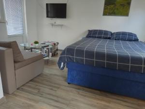 Postel nebo postele na pokoji v ubytování Apartman Borna
