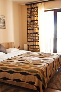 Cama o camas de una habitación en Gudauri Palace Apartments