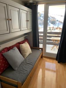 Appartement - Les 2 Alpesにあるベッド