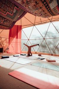 a room with a tent with a large window at Big Bang Nature Stays in Sauce de Portezuelo