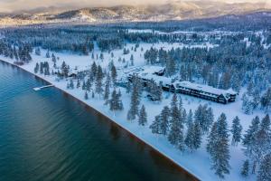 an aerial view of the shoreline of a lake with a train at Edgewood Tahoe Resort in Stateline