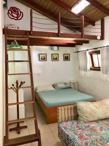 Ένα ή περισσότερα κρεβάτια σε δωμάτιο στο Casa Mico Leão Dourado