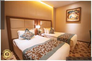 Llit o llits en una habitació de Bilitom Hotel