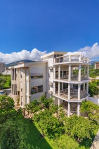 an aerial view of a white building with trees at Lux Villa Princess in Bar
