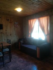 Posezení v ubytování Cabañas Tu Bosque