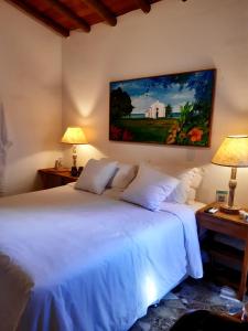 מיטה או מיטות בחדר ב-Casa Rabanete Trancoso