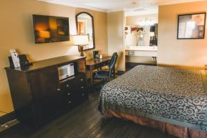 Llit o llits en una habitació de Niwas Inn