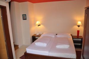 Postel nebo postele na pokoji v ubytování Hotel Carpymore