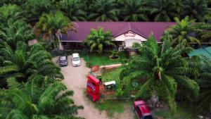 an aerial view of a house with palm trees at Hemingway Cottage 海明威度假屋 in Semporna