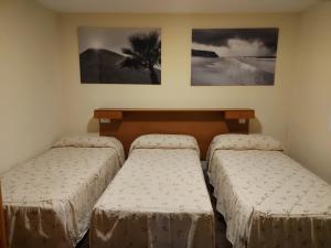 Postel nebo postele na pokoji v ubytování Hostal Moncloa