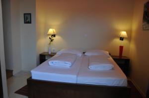 Postel nebo postele na pokoji v ubytování Hotel Carpymore