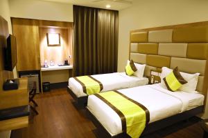Ein Bett oder Betten in einem Zimmer der Unterkunft Taz Kamar Family Hotel
