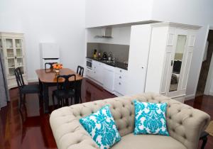 a living room with a couch with two pillows on it at Country Mile Escape in Canungra