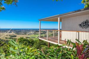 an image of a house with a balcony with a view at Byron's Secret in Coorabell Creek