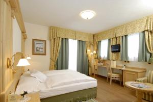 Łóżko lub łóżka w pokoju w obiekcie Hotel Paradiso