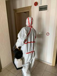 a person dressed in white is standing in a room at Golden Apple Hotel in Egirdir