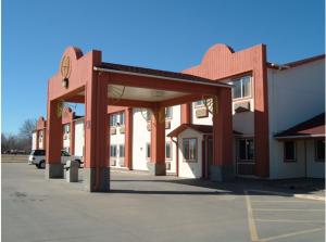 a large red building with a clock on it at Howard Johnson by Wyndham Gothenburg in Gothenburg