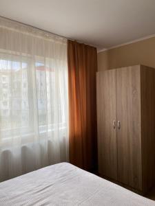 Кровать или кровати в номере 8 RESIDENCE APARTAMENT