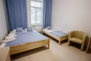 Postel nebo postele na pokoji v ubytování Discovery Hotel