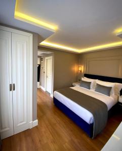 a large bedroom with a large bed in it at Ozkaya Apartments Galata in Istanbul