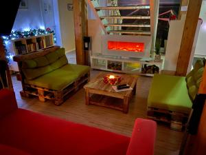 a living room filled with furniture and a fire place at My Brand Boardinghouse in Hamburg