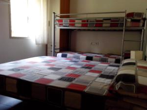 Postel nebo postele na pokoji v ubytování Cala del Pi