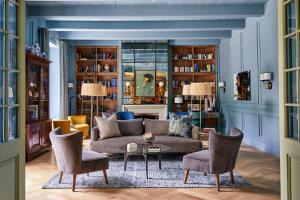 a living room with a couch and chairs at Erinvale Estate Hotel & Spa in Somerset West