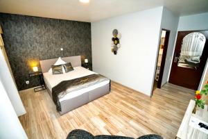 Postel nebo postele na pokoji v ubytování Parkhotel Lindenhof - KOSTENLOSE PARKPLÄTZE