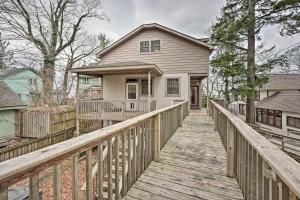 a wooden bridge leading to a house with a porch at Lake Michigan Waterfront Home 1 Mile to Downtown! in Douglas