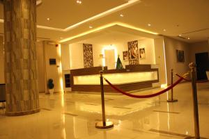 a lobby with a red rope in a building at Open Hotel in Riyadh