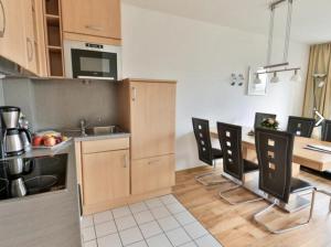 Appartement 27a - Sandburg - mit Zugang zum Gartenにあるキッチンまたは簡易キッチン