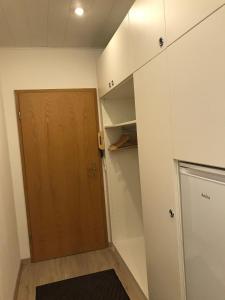 a room with a closet and a wooden door at Sport-Alpin-Wohnung-4 in Oberstdorf