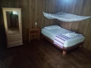 En eller flere senge i et værelse på Casa Maya