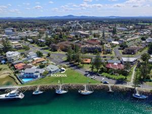 an aerial view of the marina in front of a resort at 2 Rockpool Road in Tuncurry