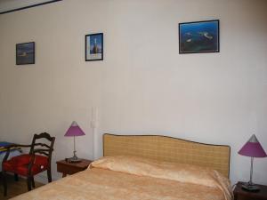 Postel nebo postele na pokoji v ubytování Hôtel Modern