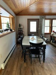a dining room with a table and chairs at Myers Chalet in Ellicottville